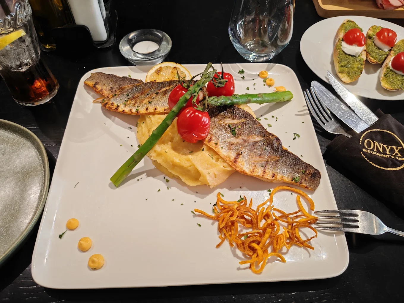 Seabass main course with vegetables at Onyx